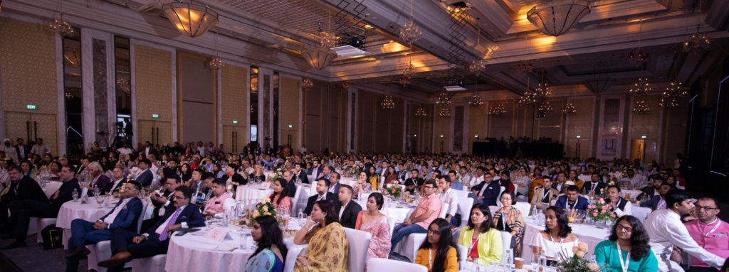 "ICWF 2024 in Jaipur: Colorful booths showcasing wedding trends, with planners networking and attending workshops"