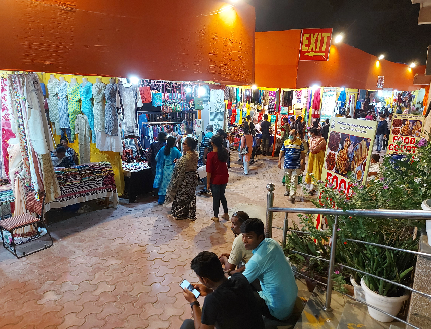 "Vibrant booths at National Handloom Fair 2024 showcasing colorful textiles and crafts from India and neighboring countries"