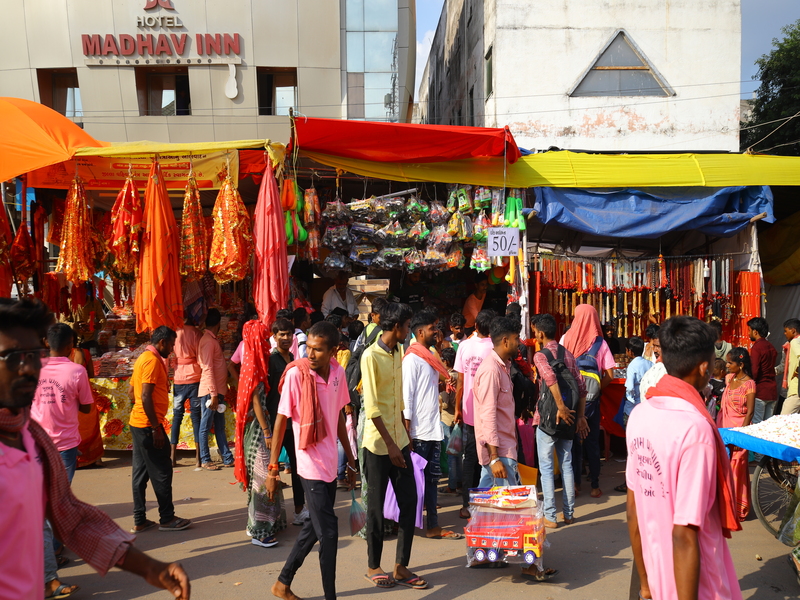Colorful Bhadarvi Poonam Fair in Ambaji, Gujarat, with crowds of devotees, temple decorations, and cultural performances"