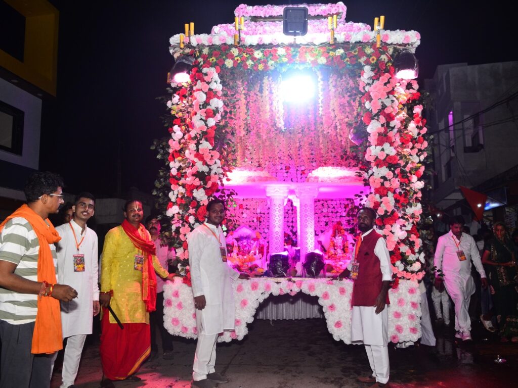 "Colorful Jal Jhulni Dol Gyaras Utsav celebration in Alirajpur, showing water worship and festive procession"