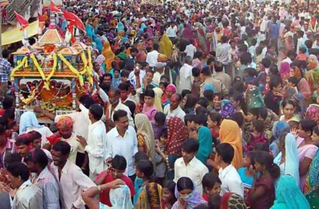 "Colorful Jal Jhulni Dol Gyaras Utsav celebration in Alirajpur, showing water worship and festive procession"