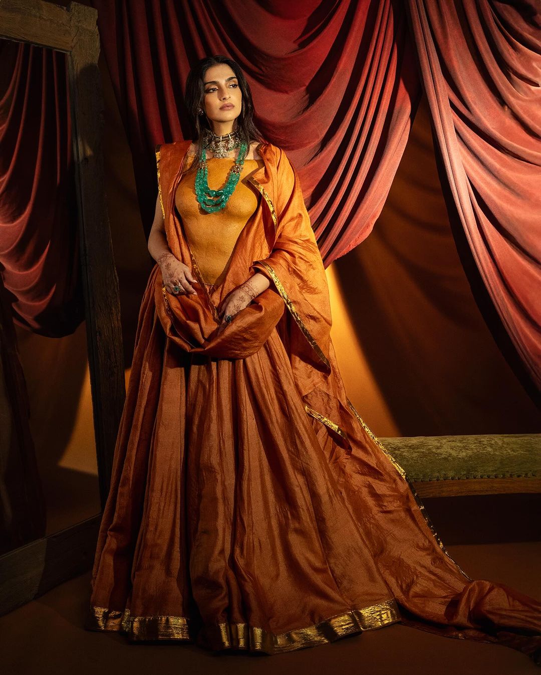 Sonam Kapoor’s styles orange lehenga not with a blouse but this mind blowing body ornament that is made of…