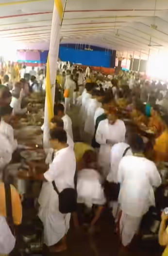 Devotees sharing food and joy with each other.