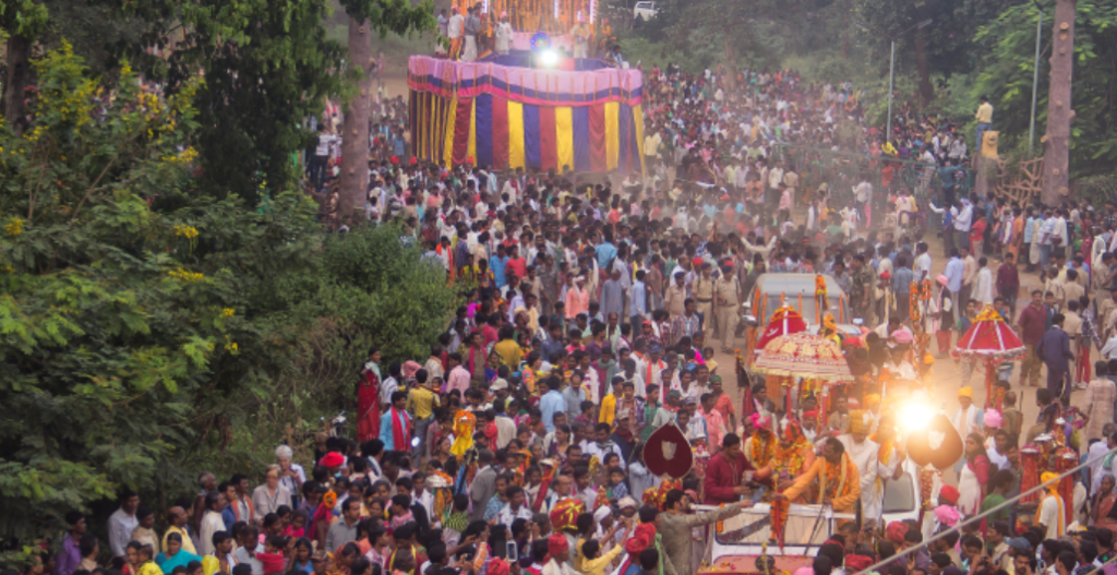 A colorful chariot procession during Bastar Dussehra with devotees pulling the chariot through the streets of Jagdalpur.