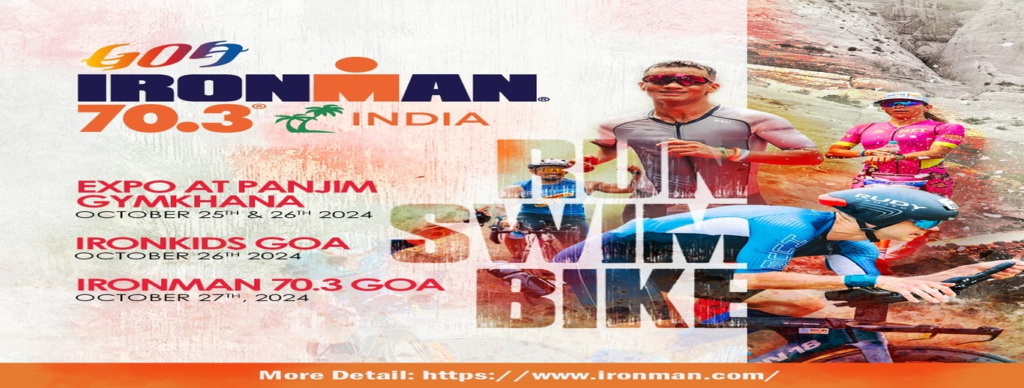 "Athletes swimming in the open waters of Miramar Beach during the IRONMAN Triathlon in Panaji, Goa."
