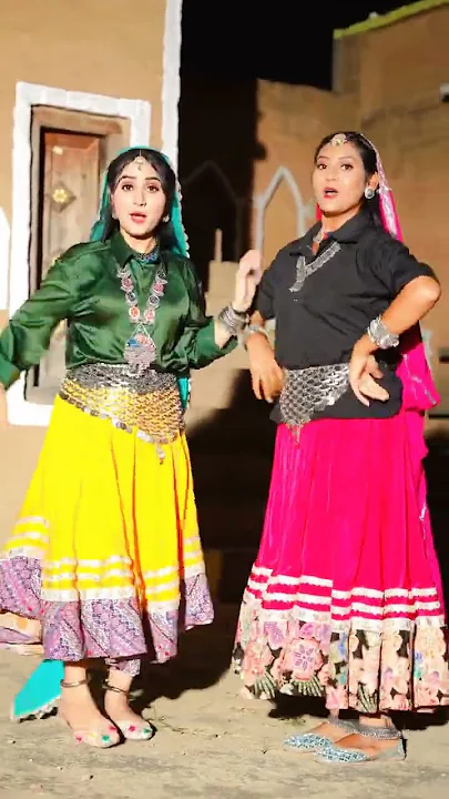 "Scene from Bahu Chatak Haryanvi song featuring Renuka Panwar and Shivani Kumari"