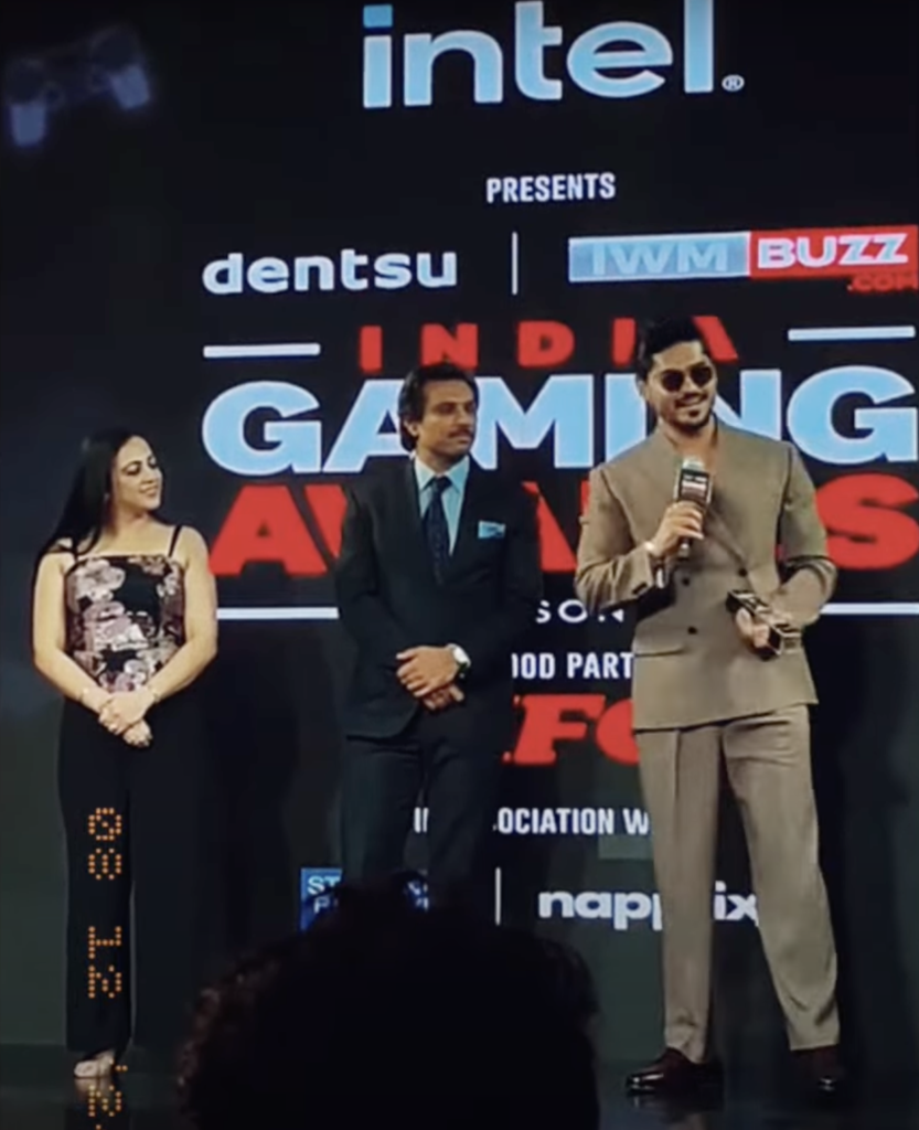 "Joker Ki Haveli, a popular YouTube creator, proudly displays his first-ever award at a glamorous ceremony, surrounded by his friends and fans, while sharing his excitement and gratitude."