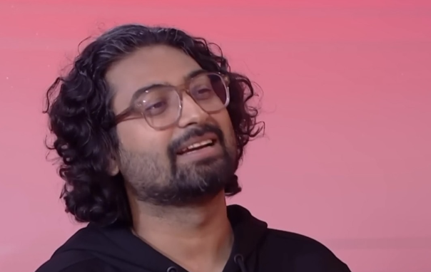 "Ravi Gupta comedian in a funny pose from his viral YouTube video 'Japan vs. India,' with a YouTube play button and text 'Viral Laughs with Ravi Gupta!' in a bold red and black design."